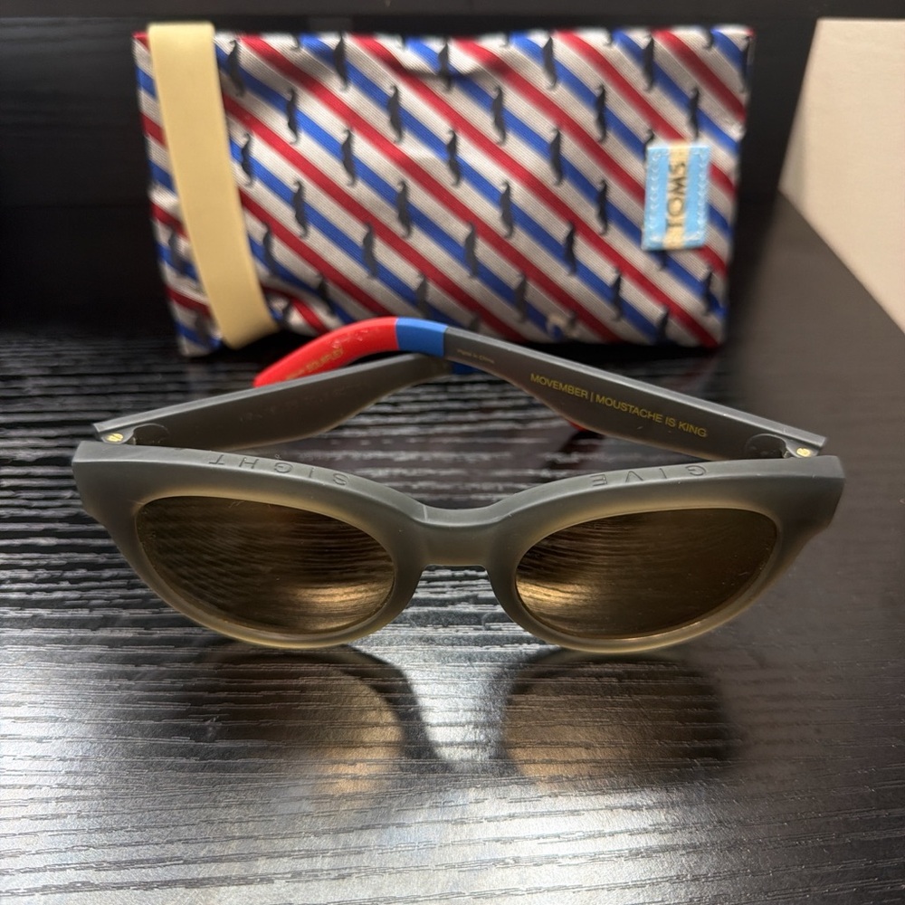 Toms Matte Gray Round Sunglasses with Blue & Red Temple Accents